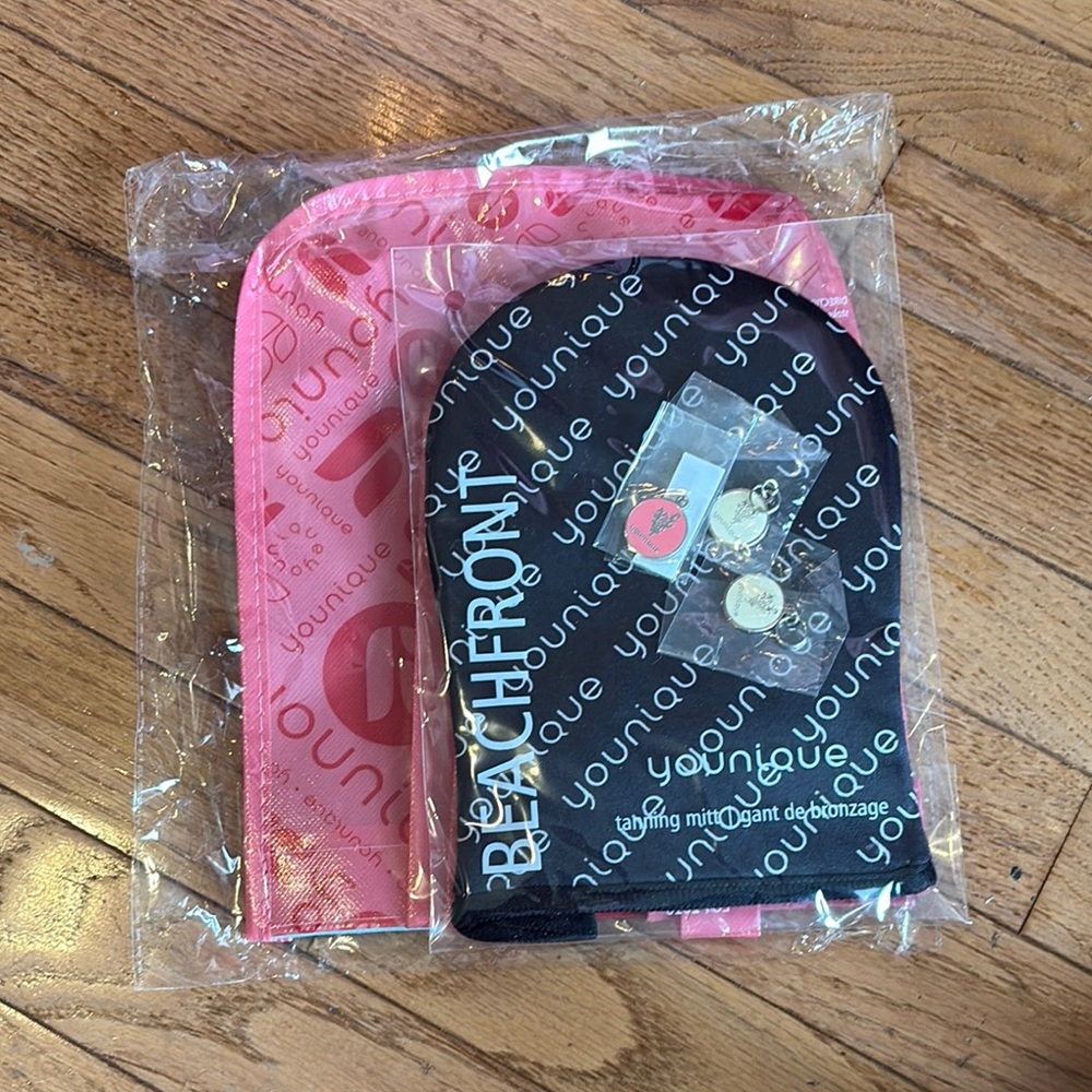 Younique gift 🎁 bag and tanning mitt and 3 charms